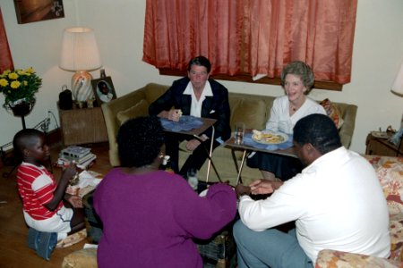 President Ronald Reagan and Nancy Reagan sitting and talking having dinner at home of Rudolph Rudy Hines in Washington DC