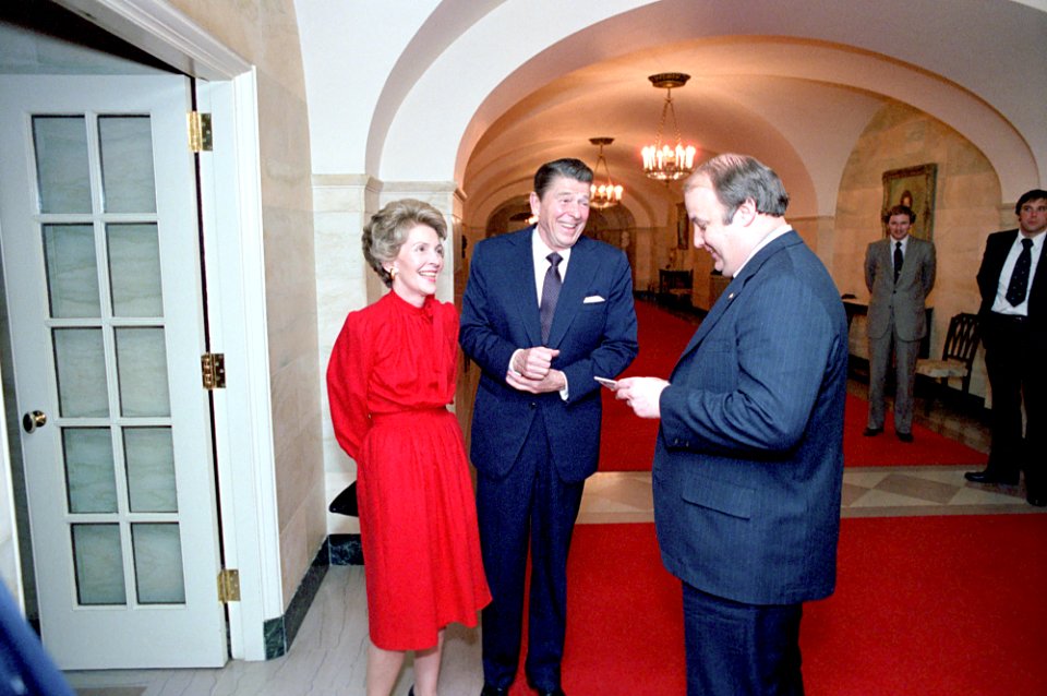 President Ronald Reagan and Nancy Reagan talking with James Brady