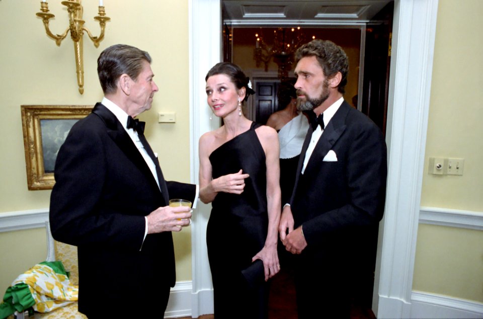 President Ronald Reagan talking with Audrey Hepburn and Robert Wolders