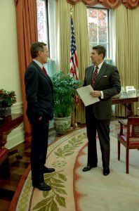 President Ronald Reagan talking with Vice President George H. W. Bush in the Oval Office photo