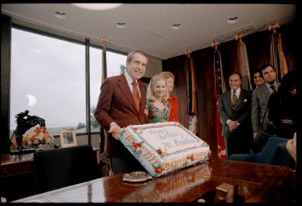 President Richard Nixon Admires His 61st Birthday Cake while Celebrating with Family and Staff Members at the Western White House (02) photo