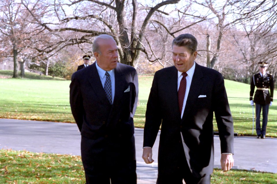 President Ronald Reagan walking with George Shultz outside the Oval Office