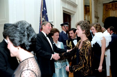 President Ronald Reagan with Carol Burnett and Carrie Hamilton in the receiving line during the State Visit of King Birendra Bir Kikram Shah Dev of Nepal in the East Room
