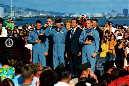 President Richard Nixon and the Apollo 13 astronauts stand at attention for the National Anthem at a ceremony photo