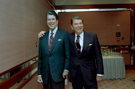 President Ronald Reagan standing next to a life size cardboard cut-out of himself at the Sheraton Hotel in Washington D.C
