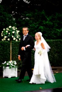 President Richard Nixon escorts daughter Tricia to her wedding in the White House Rose Garden