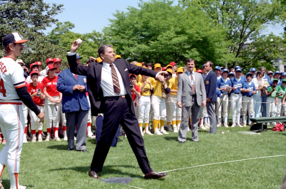 President Ronald Reagan throwing out the first pitch during baseball game between the Athletes and the Dodgers two Pony League Teams from Glen Burnie Maryland on South Lawn