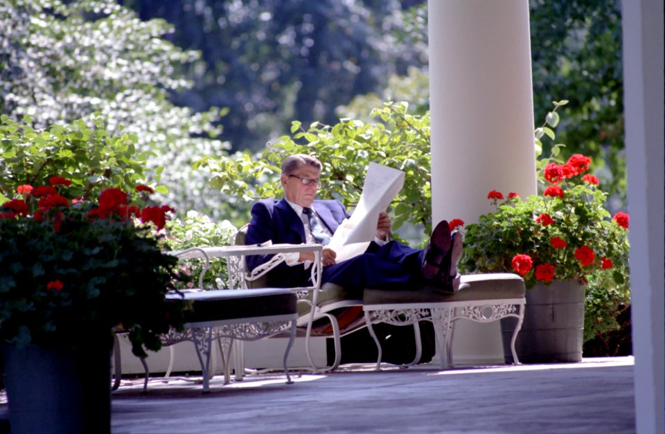 President Ronald Reagan working alone on colonnade outside the Oval Office