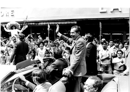 President Richard Nixon Stands up in a Convertible Car while Waving to a Crowd En Route to the Laredo, Texas U.S. Bureau of Customs Border Station Facilities