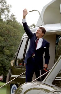 President Ronald Reagan waves as he departs via Marine One from South lawn for Andrews AFB and trip to Newark