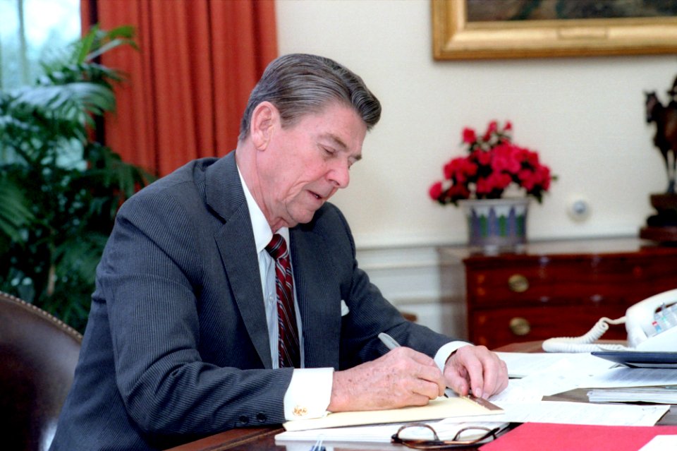 President Ronald Reagan writing his State of the Union Address in the Oval Office