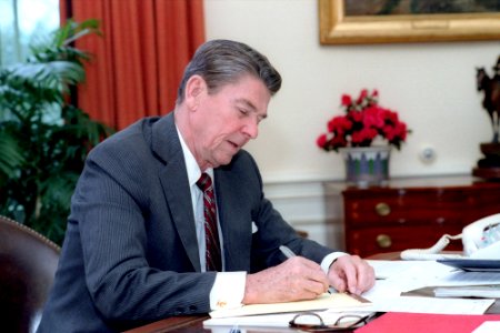 President Ronald Reagan writing his State of the Union Address in the Oval Office