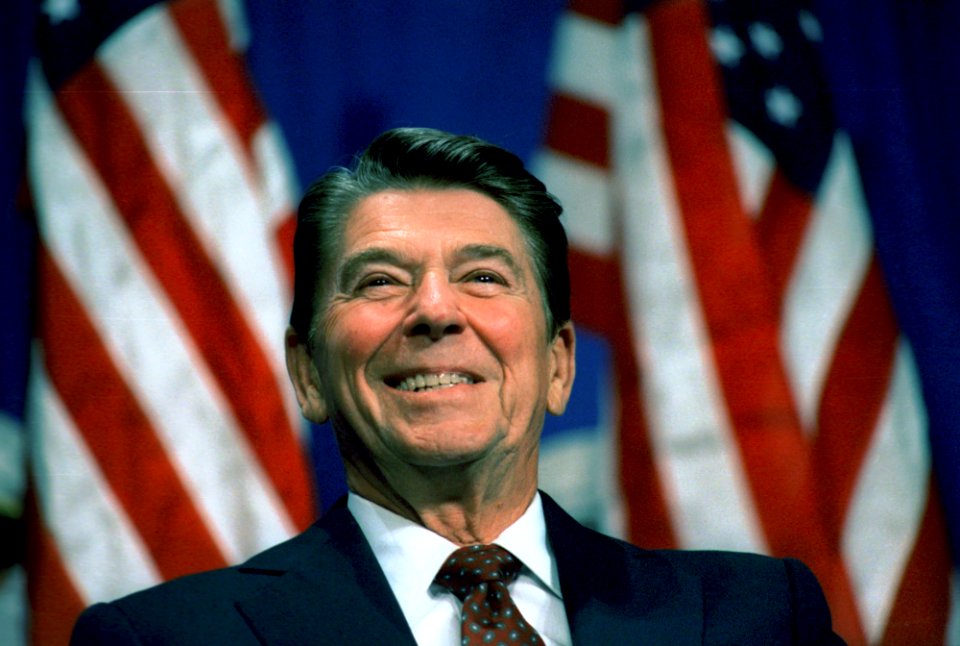 President Ronald Reagan at a Virginia Republican Party Fundraising Rally with Us Flags Behind in Richmond Virginia