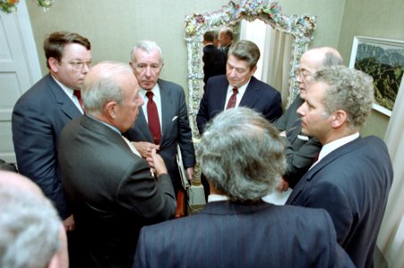 President Ronald Reagan, Don Regan, and George Shultz at a staff briefing during the Reykjavik Summit in Iceland