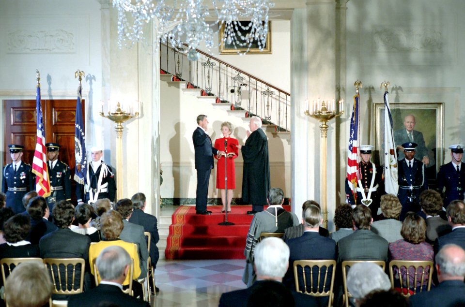 President Ronald Reagan, Nancy Reagan and Chief Justice Warren Burger at the Private Inaugural Swearing-in Ceremony on the Grand Staircase in the White House