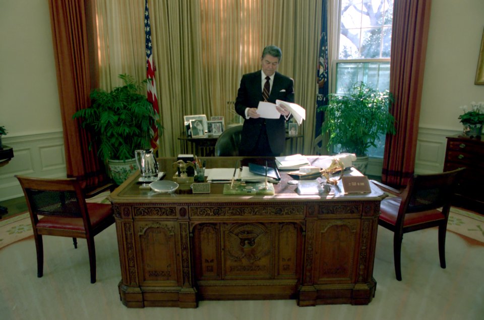 President Ronald Reagan alone in the Oval Office