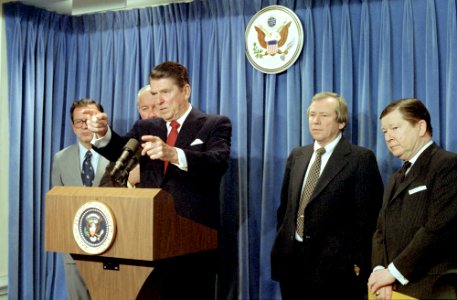 President Ronald Reagan, Bob Michel, Ted Stevens, John Tower, and Howard Baker giving a statement in the Press Room