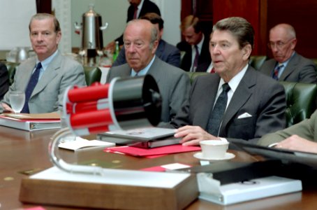 President Ronald Reagan, George Shultz, and James Baker in a National Security Council Meeting