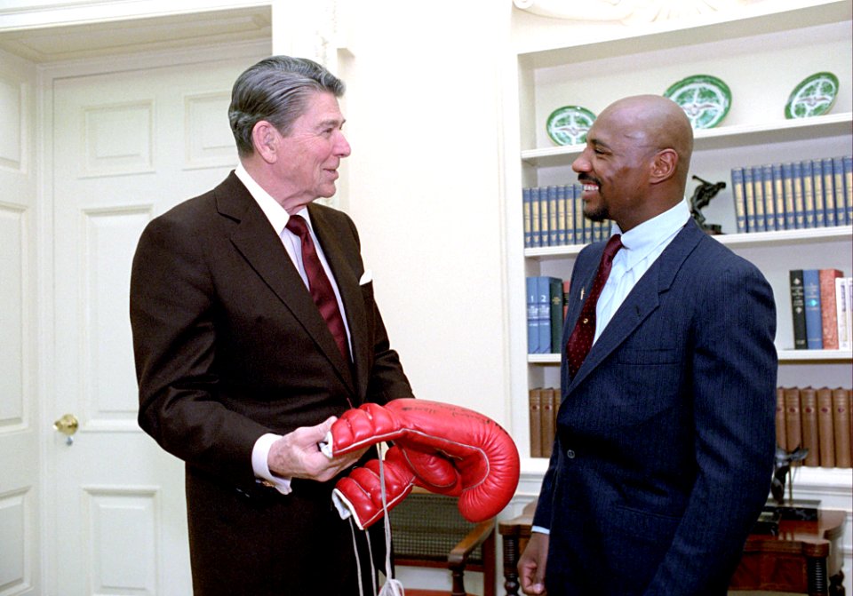 President Ronald Reagan during a photo op. with boxer Marvin Hagler in the Oval Office