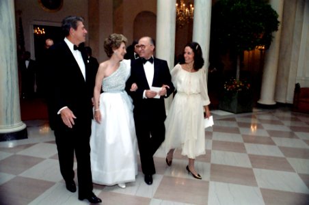 President Ronald Reagan, Menachem Begin, Nancy Reagan, and Matti Milo in Cross Hall Following a State Dinner for Prime Minister Menachem Begin of Israel