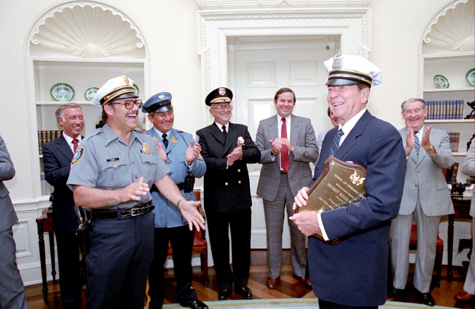 President Ronald Reagan during a photo opportunity with senior officers of the Police Association affiliated with the National Law Enforcement Council in the Oval Office photo