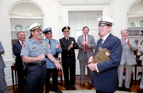 President Ronald Reagan during a photo opportunity with senior officers of the Police Association affiliated with the National Law Enforcement Council in the Oval Office photo