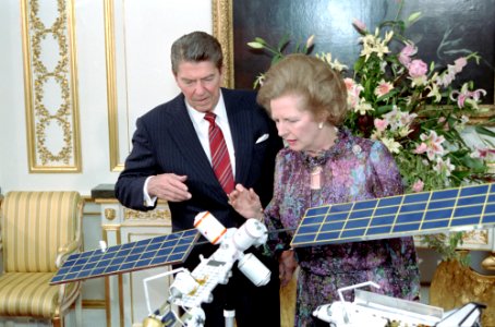 President Ronald Reagan and Margaret Thatcher viewing model of manned Space Station at Lancaster House in London