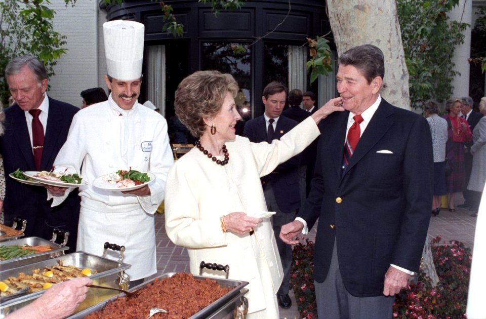 President Ronald Reagan and Nancy Reagan at a luncheon for the Ronald Reagan Library Foundation at the Henry Singleton residence in California