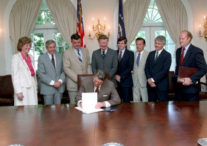 President Ronald Reagan during the signing ceremony for the Federal Employee's Retirement System Act of 1986