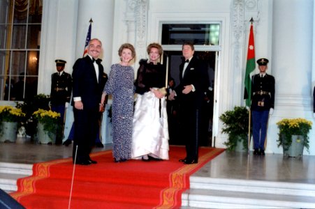 President Ronald Reagan and Nancy Reagan greet King Hussein I and Queen Noor