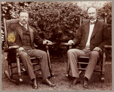President Theodore Roosevelt and Vice President Charles Fairbanks, seated in rocking chairs on a lawn LCCN2009631545