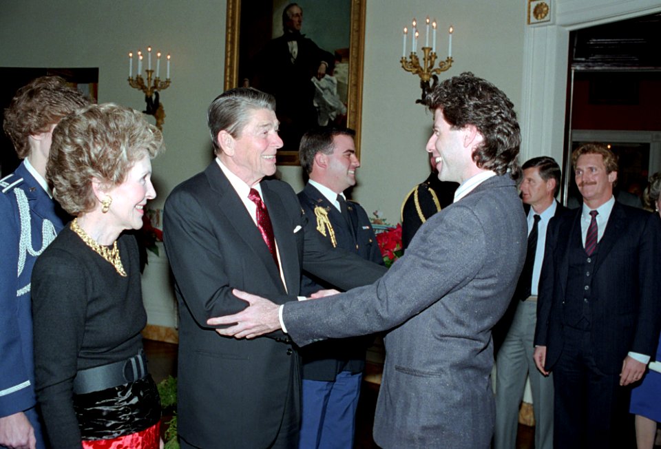 President Ronald Reagan and Nancy Reagan meeting with John Travolta