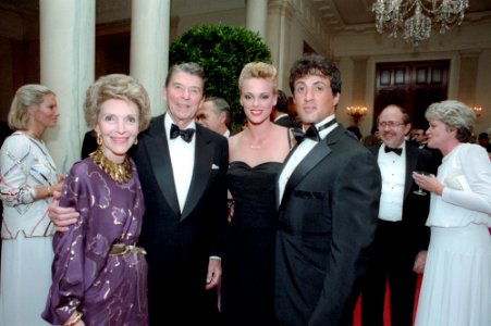 President Ronald Reagan and Nancy Reagan posing with Sylvester Stallone and Brigitte Nielsen
