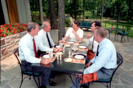 President Ronald Reagan having a luncheon meeting at Camp David photo