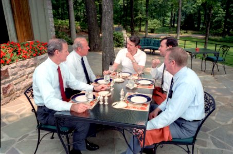 President Ronald Reagan having a luncheon meeting at Camp David