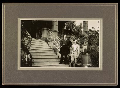 President Theodore Roosevelt standing on steps, possibly with his son Kermit LCCN2016651372