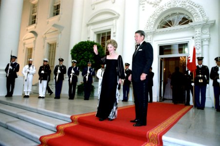 President Ronald Reagan and Nancy Reagan standing at the North Portico before the state dinner for the Amir of the State of Bahrain Isa Bin Sulman Al-Khalifa