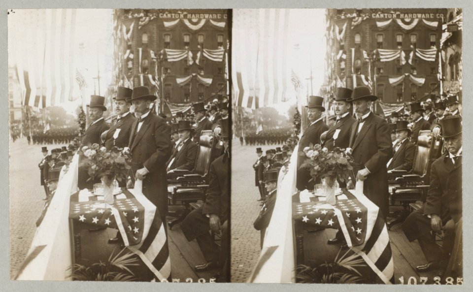 President Theodore Roosevelt standing with men viewing parade LCCN2013645460