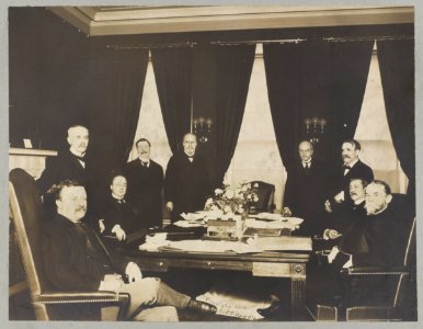 President Theodore Roosevelt with members of his cabinet seated and standing around a table LCCN2009634002