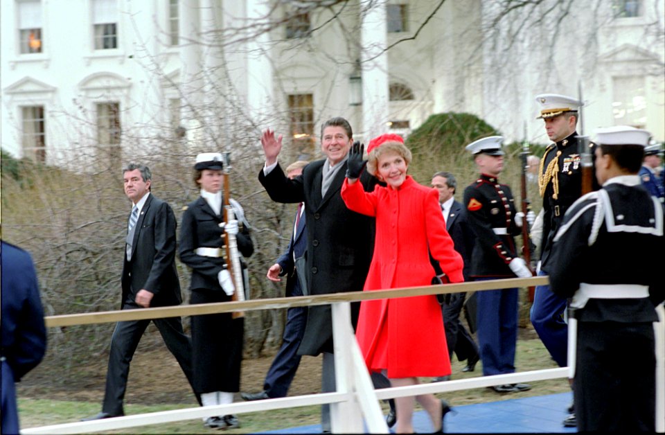President Ronald Reagan and Nancy Reagan walking to the parade viewing stands from the White House on Inauguration day