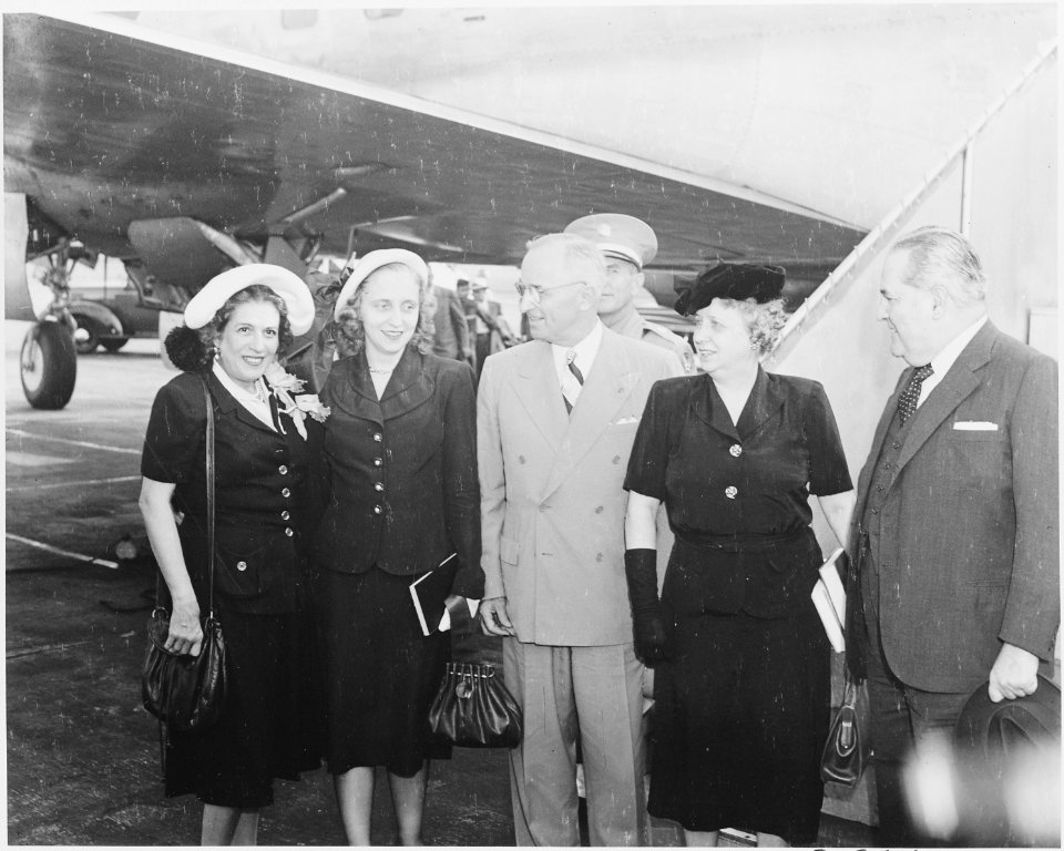 President Truman and his party prepare to board the presidential airplane to fly to Brazil. L to R, Mrs. Carlos... - NARA - 199690