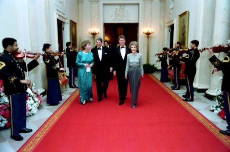 President Ronald Reagan and Nancy Reagan with Bill Clinton and Hillary Clinton walking in the Cross Hall