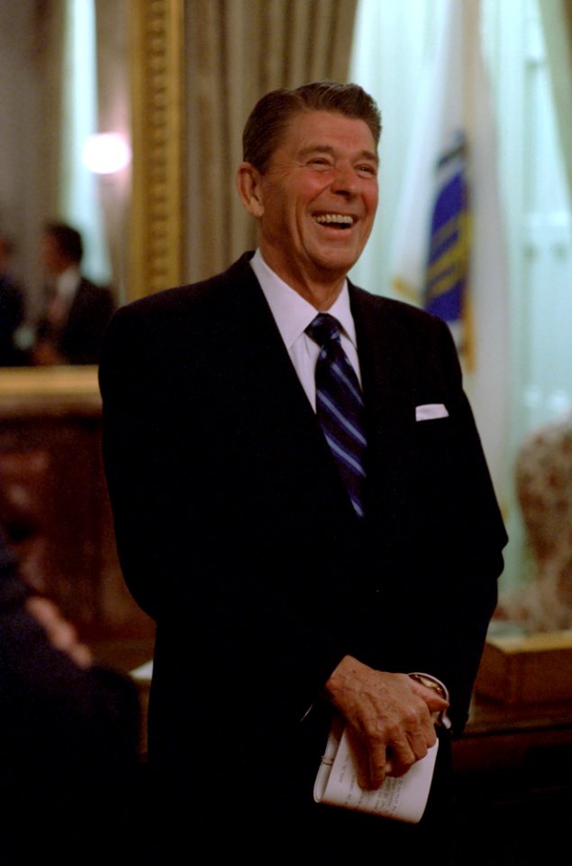 President Ronald Reagan laughing at meetings before Economic Speech to Congress at US Capitol
