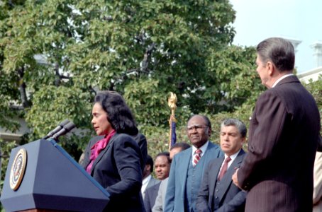 President Ronald Reagan listening to Coretta Scott King during the Signing Ceremony for H.R. 3706, making the birthday of Martin Luther King Jr. a national Holiday