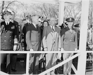 President Truman attends the Army Day parade in Washington, D. C. He is on the reviewing stand between two... - NARA - 199605