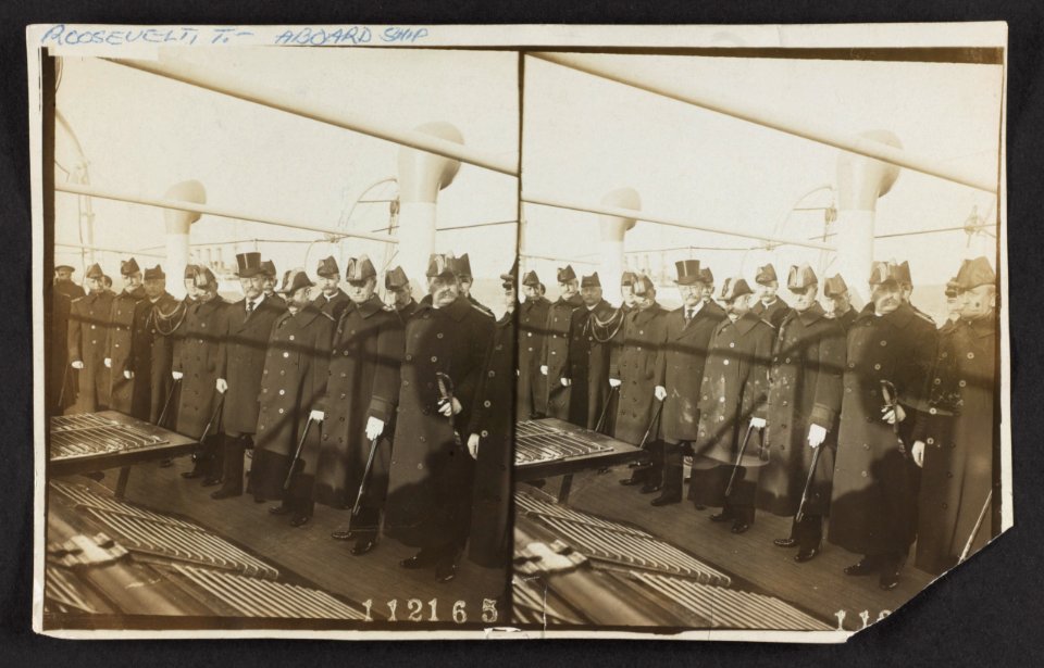 President Theodore Roosevelt posing with military officials on a ship LCCN2013651461