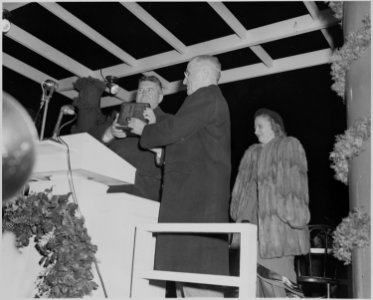 President Truman lights the White House Christmas Tree during ceremonies outside the White House. Daughter Margaret... - NARA - 199663