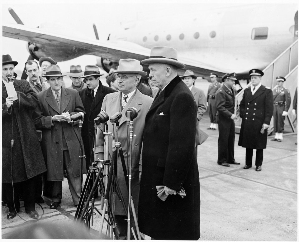 President Truman and Secretary of State George Marshall are at microphones at the National Airport in Washington, D.... - NARA - 199677