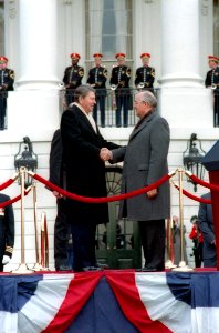 President Ronald Reagan and Soviet General Secretary Mikhail Gorbachev shaking hands at the arrival ceremony on the White House south lawn