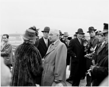 President Truman at National Airport in Washington, D. C. is talking with Mrs. George Marshall. Secretary of State... - NARA - 199675 photo